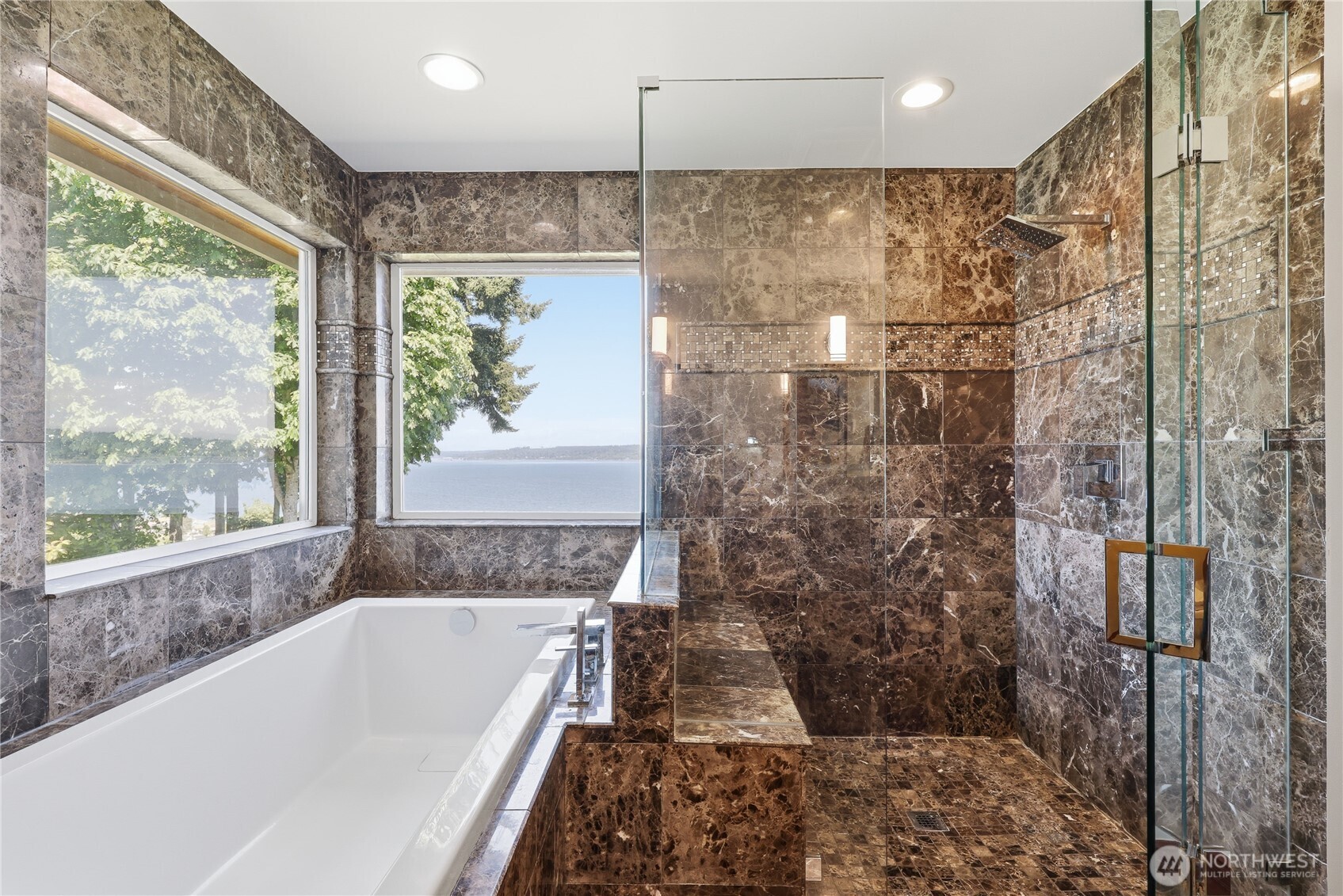 1411 Thorndyke Road Port Ludlow, WA 98365 - Photo 31 of 40 a bathroom with a bathtub and a shower