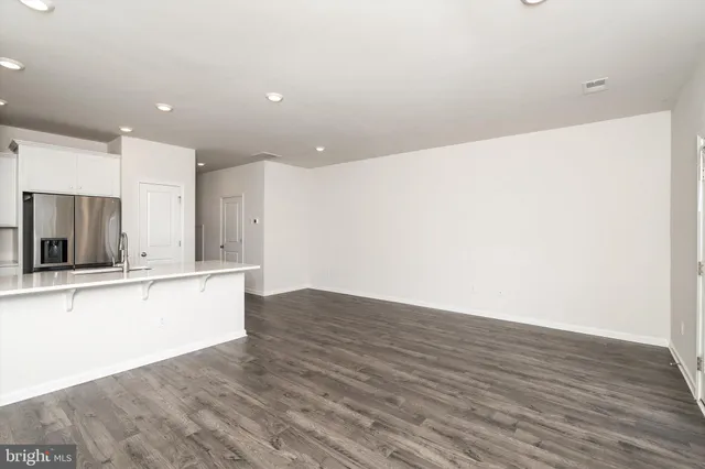 a view of kitchen with wooden floor