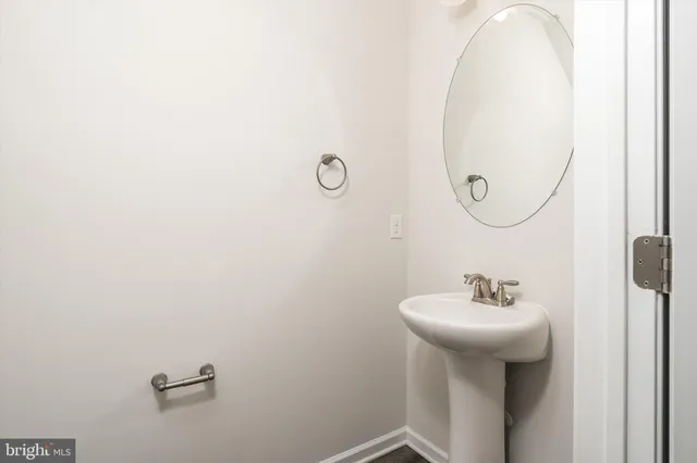 a bathroom with a sink and mirror