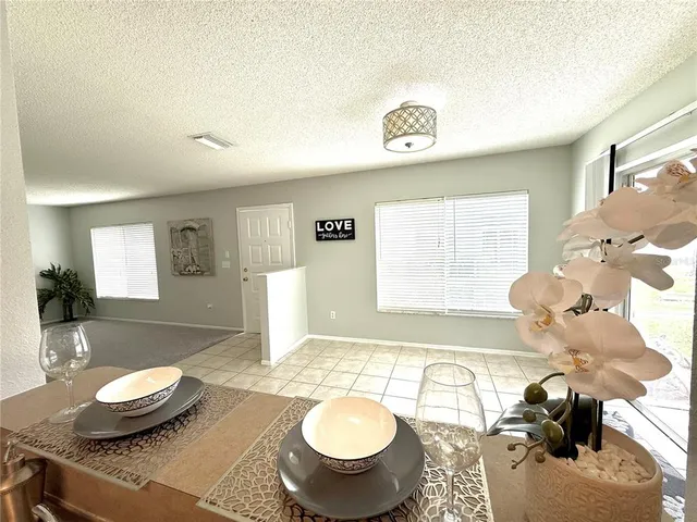 a living room with furniture and a table