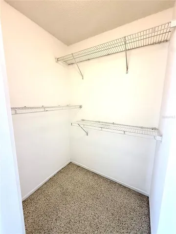 a view of a room with racks on the wall