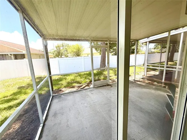 a view of an empty room and a large window