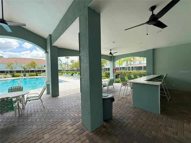 a view of a park with swings and slides