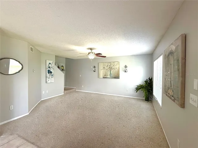 a view of a hallway with windows
