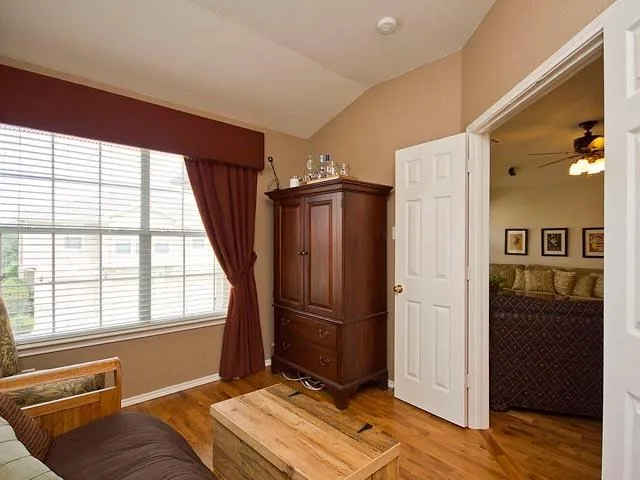 a view of a living room with a large window