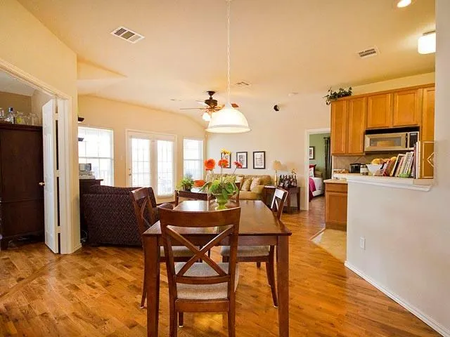 a view of a dining room with furniture window and wooden floor