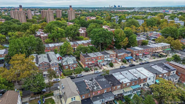 an aerial view of a house with a yard and garden