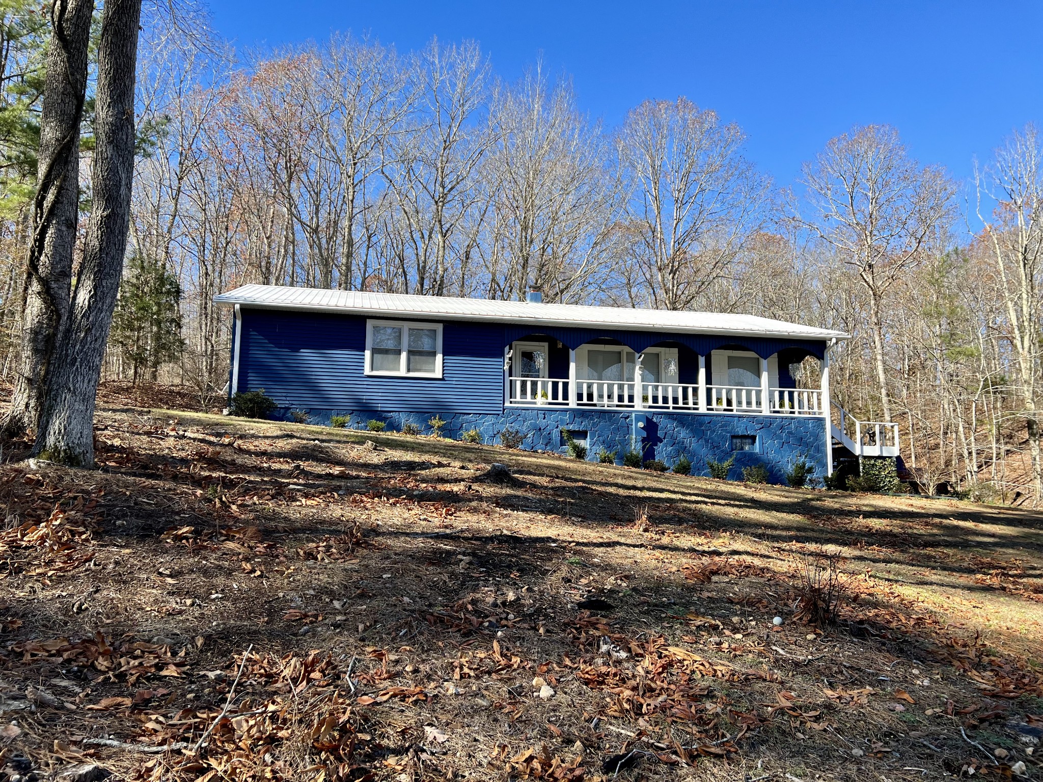 1110 Harmon Creek Road Eva, TN 38333 - Photo 2 of 18 a view of a house with a yard