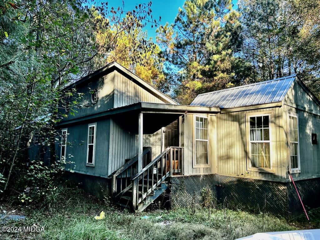 697 Old Cabaniss Road Forsyth, GA 31029 - Photo 1 of 2 a front view of a house with garden