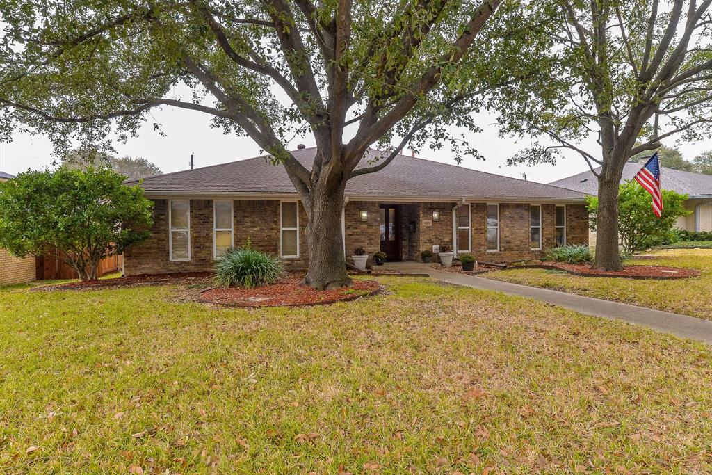 9235 Locarno Drive Dallas, TX 75243 - Photo 1 of 1 a view of a house with swimming pool and a large tree