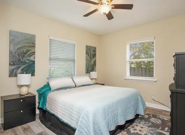 a bedroom with a bed and a window