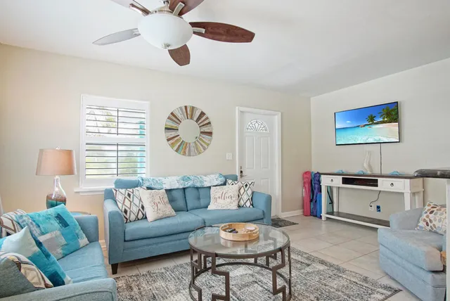 a living room with furniture and a window