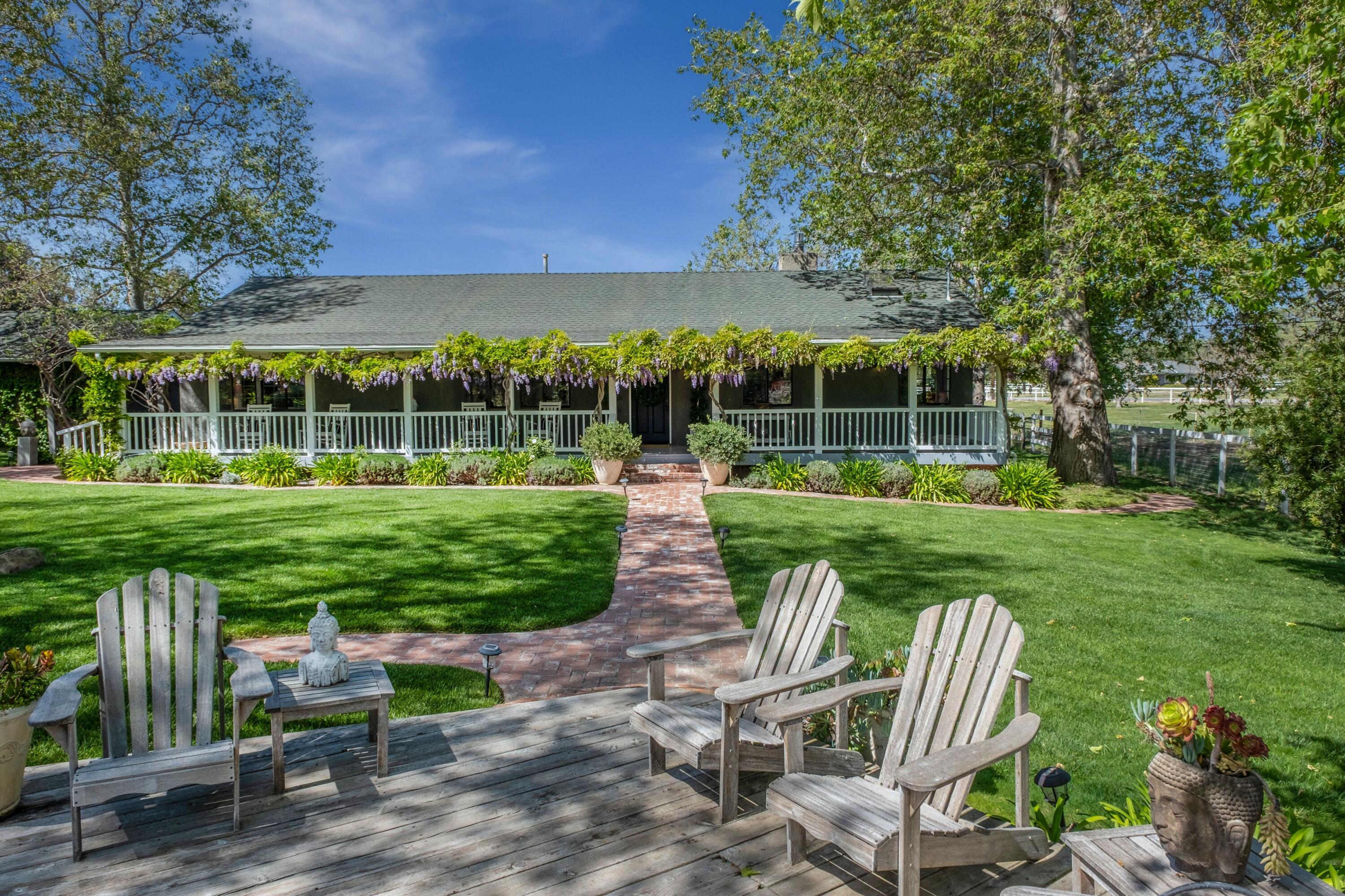 a view of a table and chairs in the garden