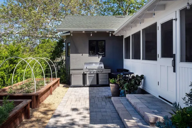 an aerial view of a house with yard swimming pool and outdoor seating