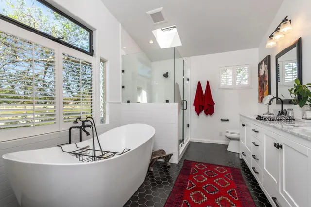 a living room with furniture a dining table and kitchen view