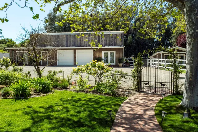 a view of an empty room with wooden walls