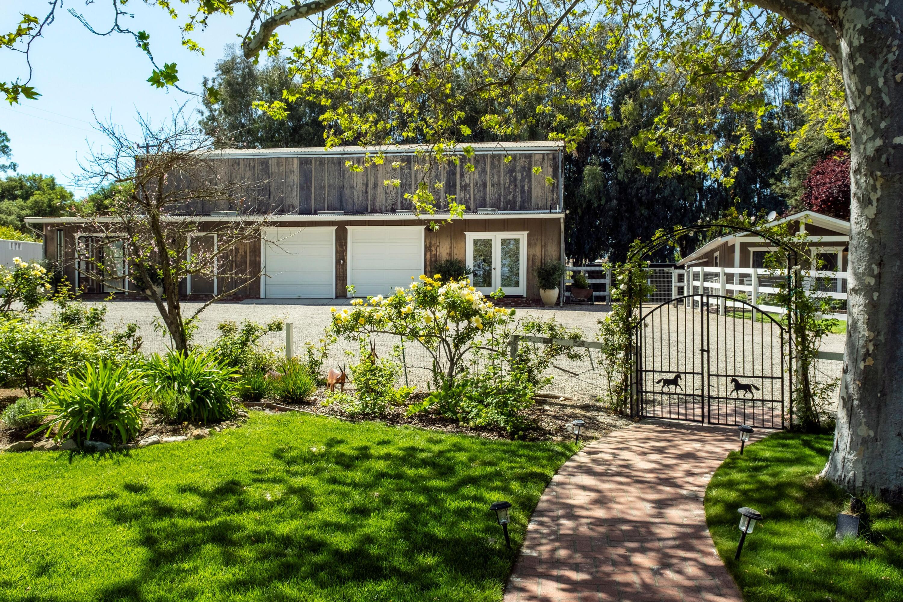 2921 Ontiveros Road Santa Ynez, CA 93460 - Photo 31 of 83 a view of a chair and table in the garden
