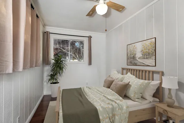 a view of a house with a wooden fence