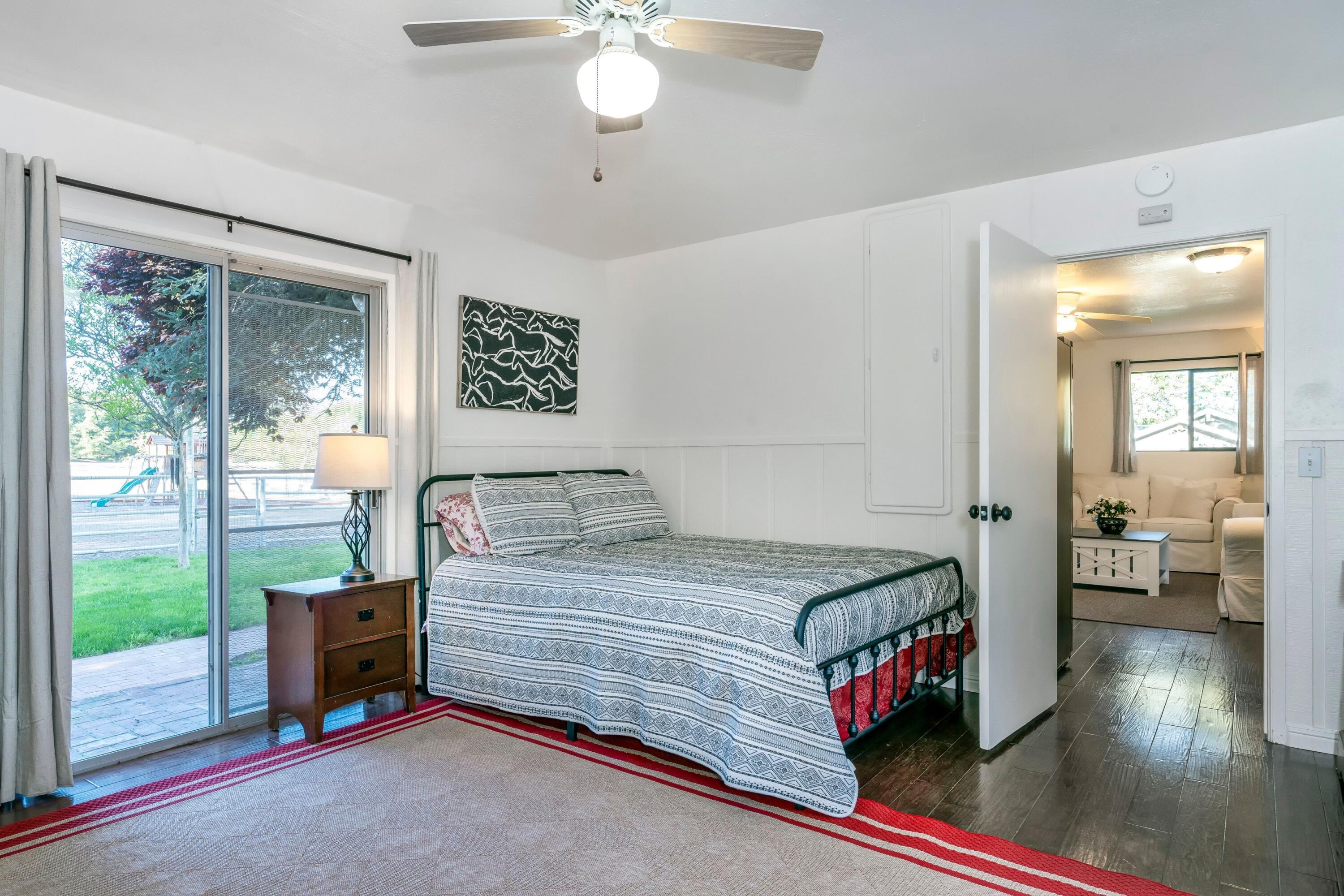 2921 Ontiveros Road Santa Ynez, CA 93460 - Photo 44 of 83 a bedroom with a bed and a chandelier