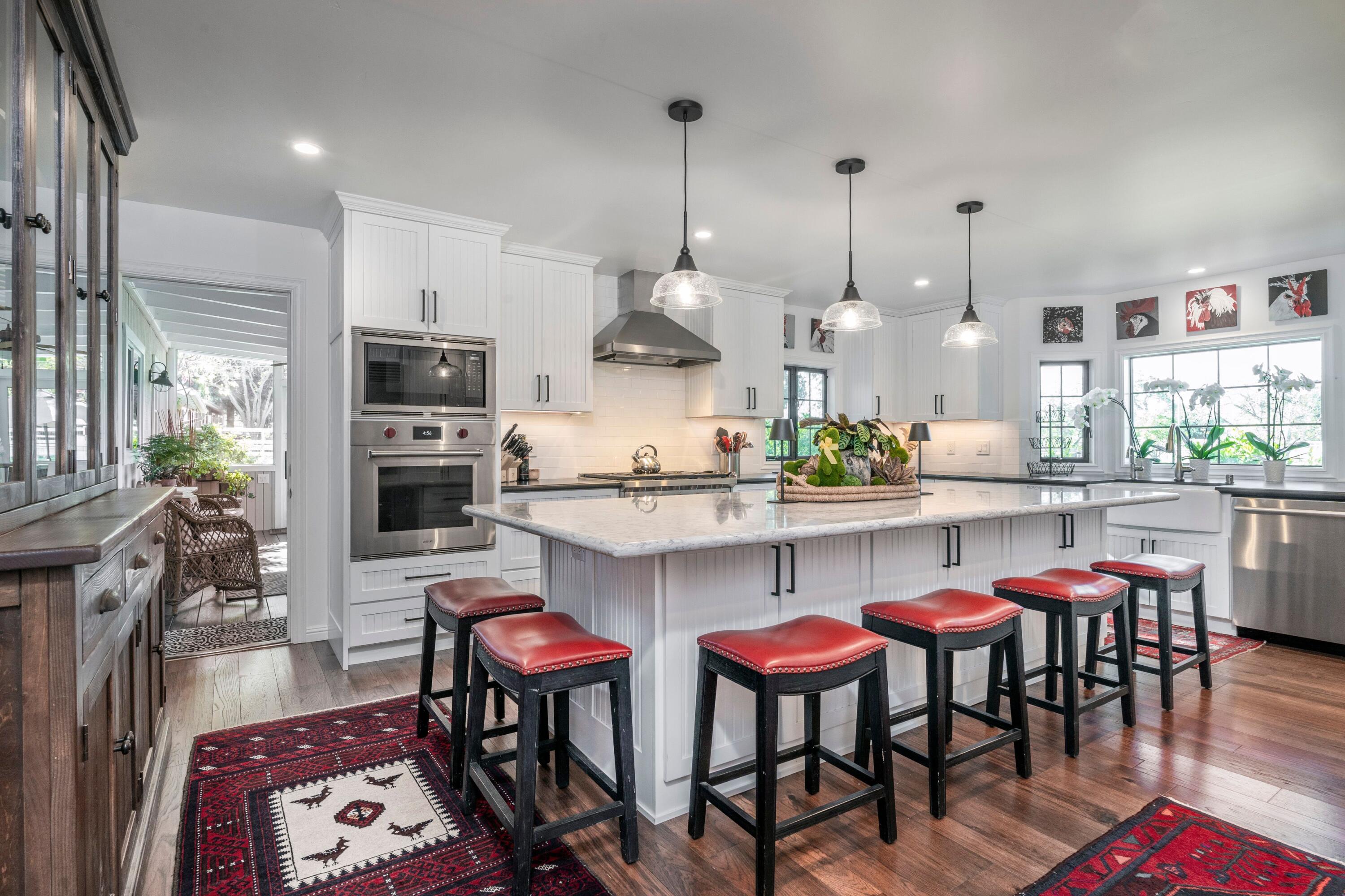 2921 Ontiveros Road Santa Ynez, CA 93460 - Photo 8 of 83 a kitchen with stainless steel appliances a dining table chairs stove and sink