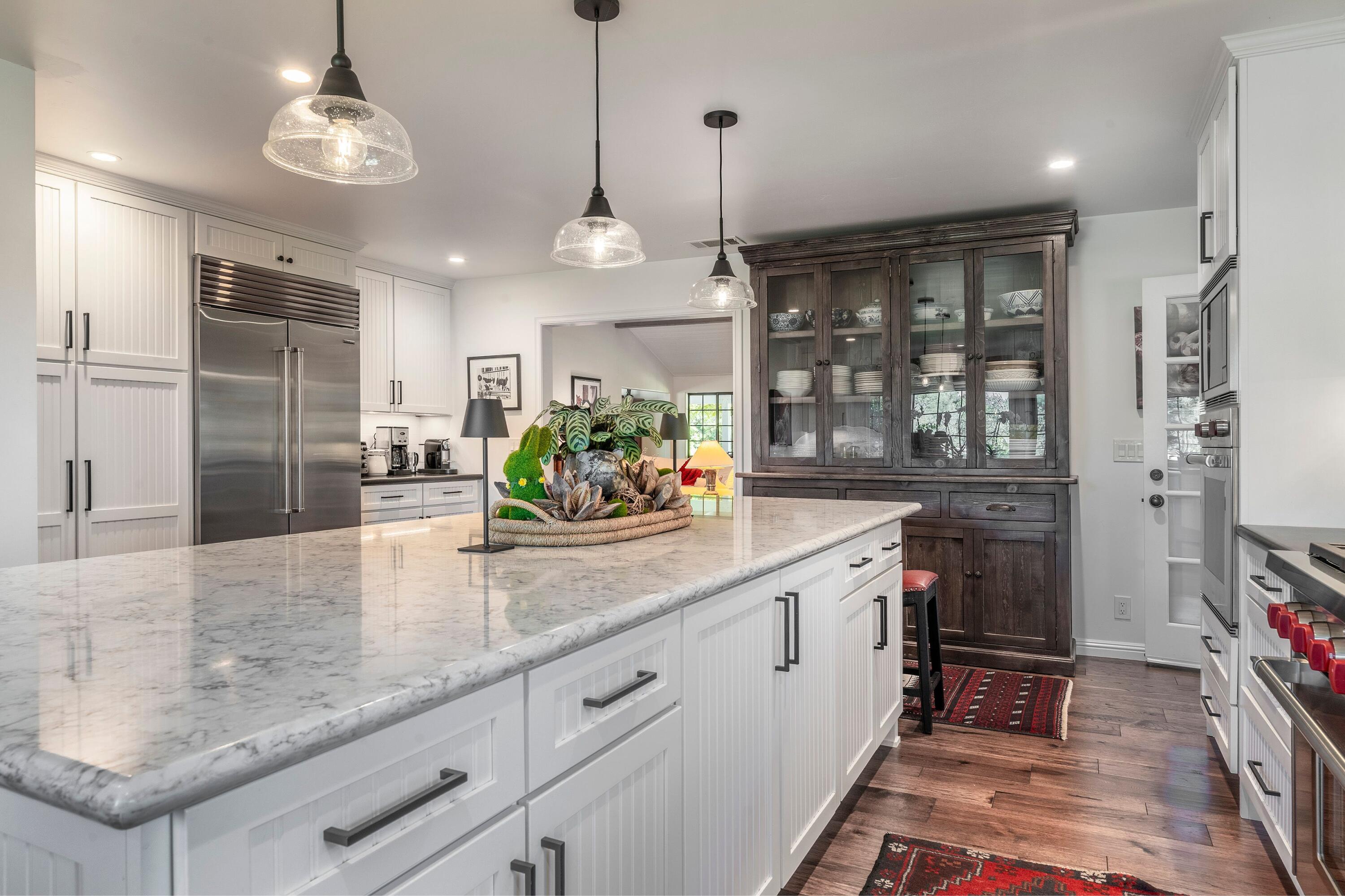 2921 Ontiveros Road Santa Ynez, CA 93460 - Photo 9 of 83 a kitchen with stainless steel appliances granite countertop a sink a refrigerator and a counter space