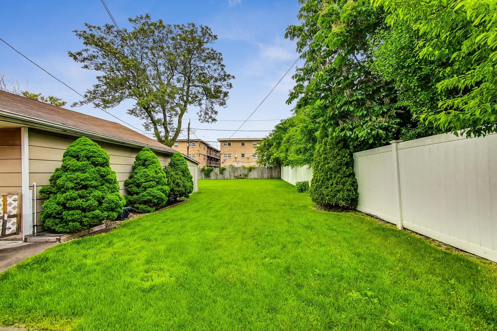 6730 West Dakin Street Chicago, IL 60634 - Photo 3 of 6 a view of an outdoor space and a yard