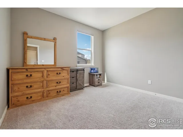a view of a bedroom with cabinet cabinet and mirror