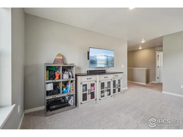 a living room with lots of furniture and a flat screen tv