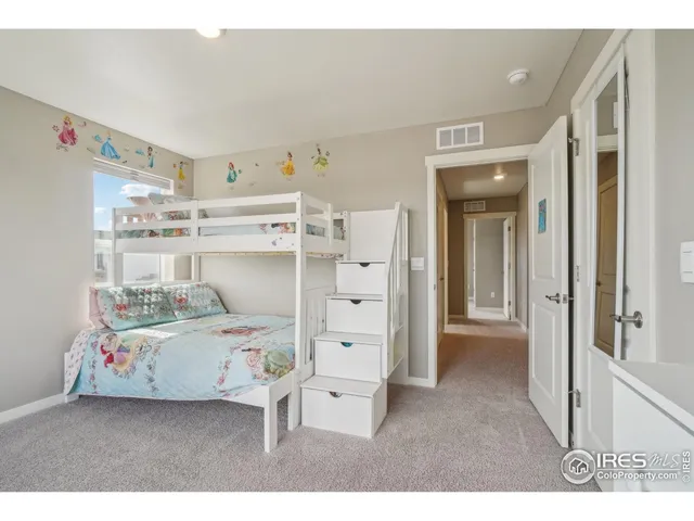 a bed room with a bed and a window