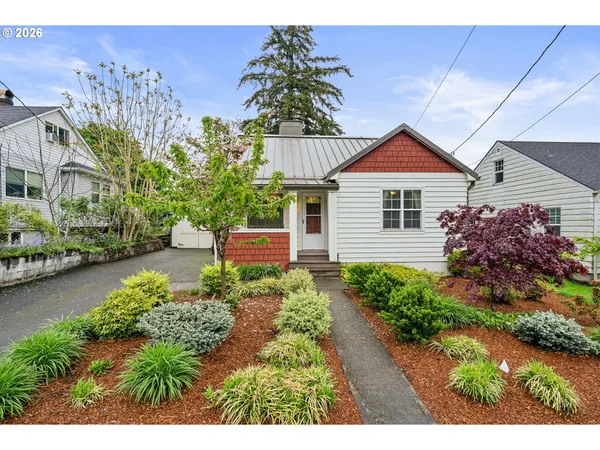 a view of a house with a garden