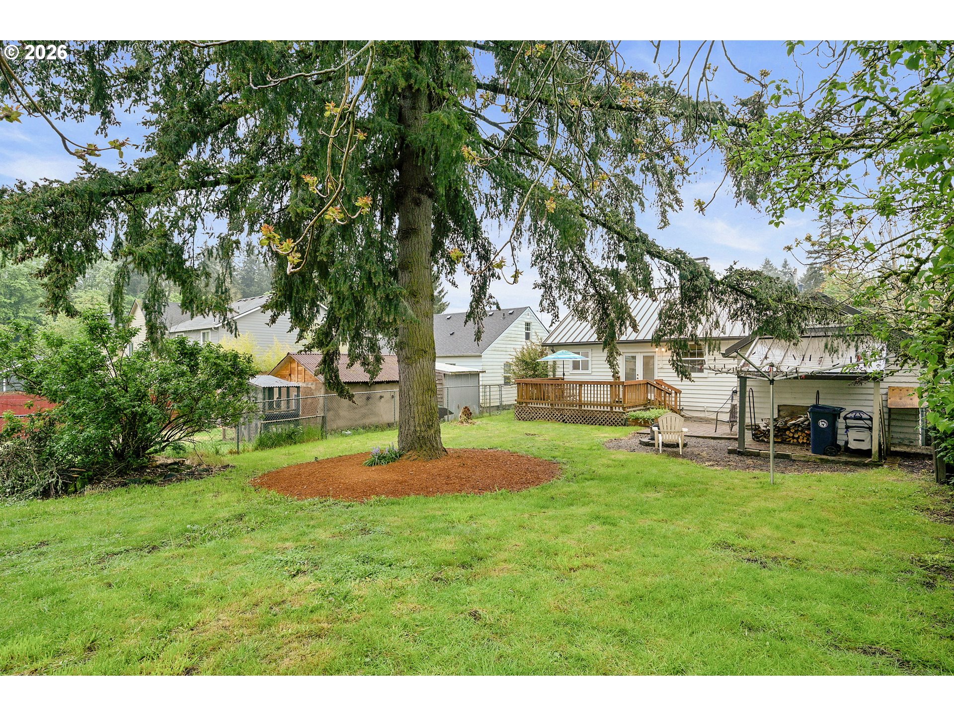 634 Northwest Ivy Street Camas, WA 98607 - Photo 24 of 27 a view of yard with swimming pool and trees