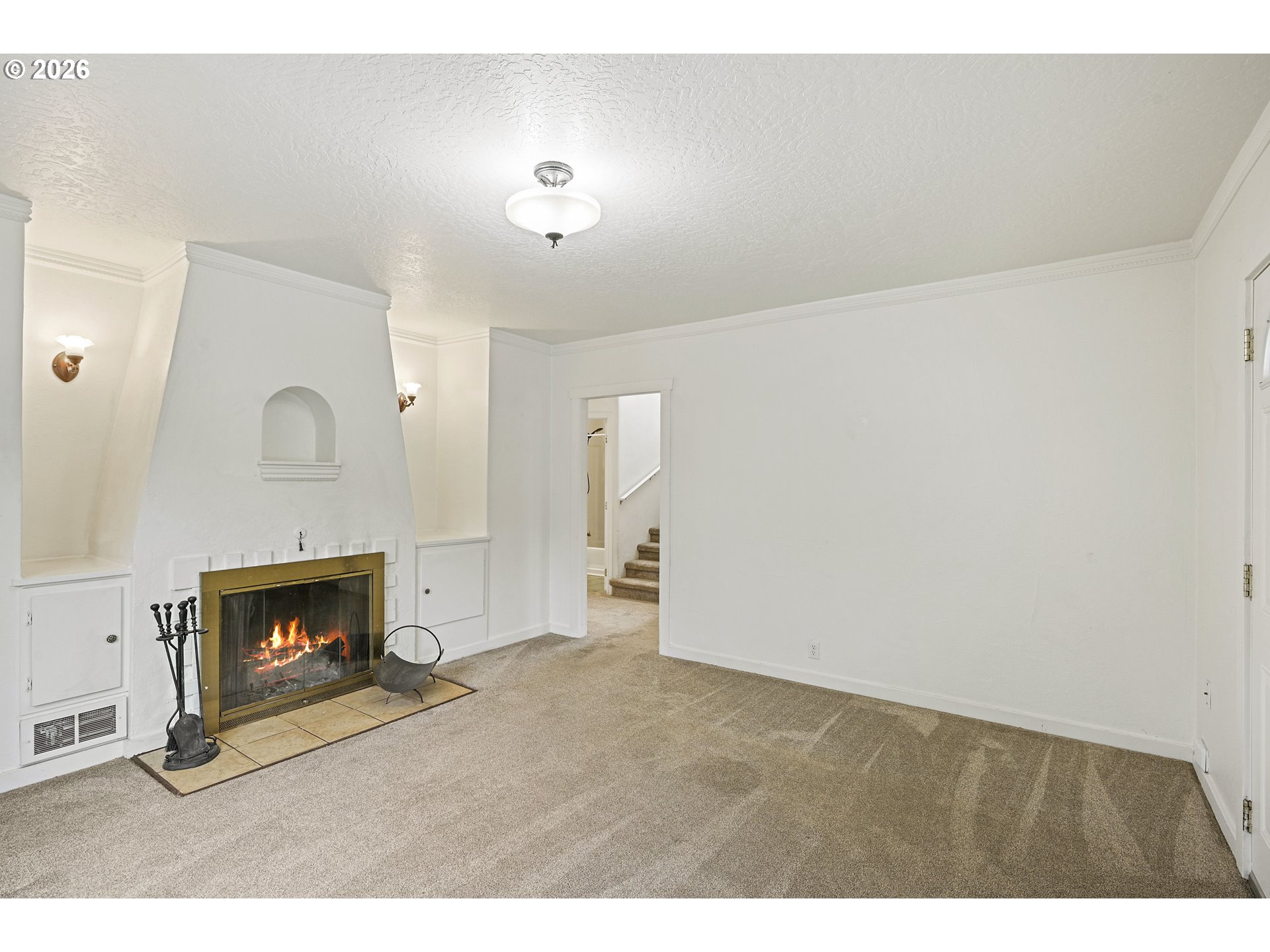 634 Northwest Ivy Street Camas, WA 98607 - Photo 5 of 27 a view of an empty room with a fireplace