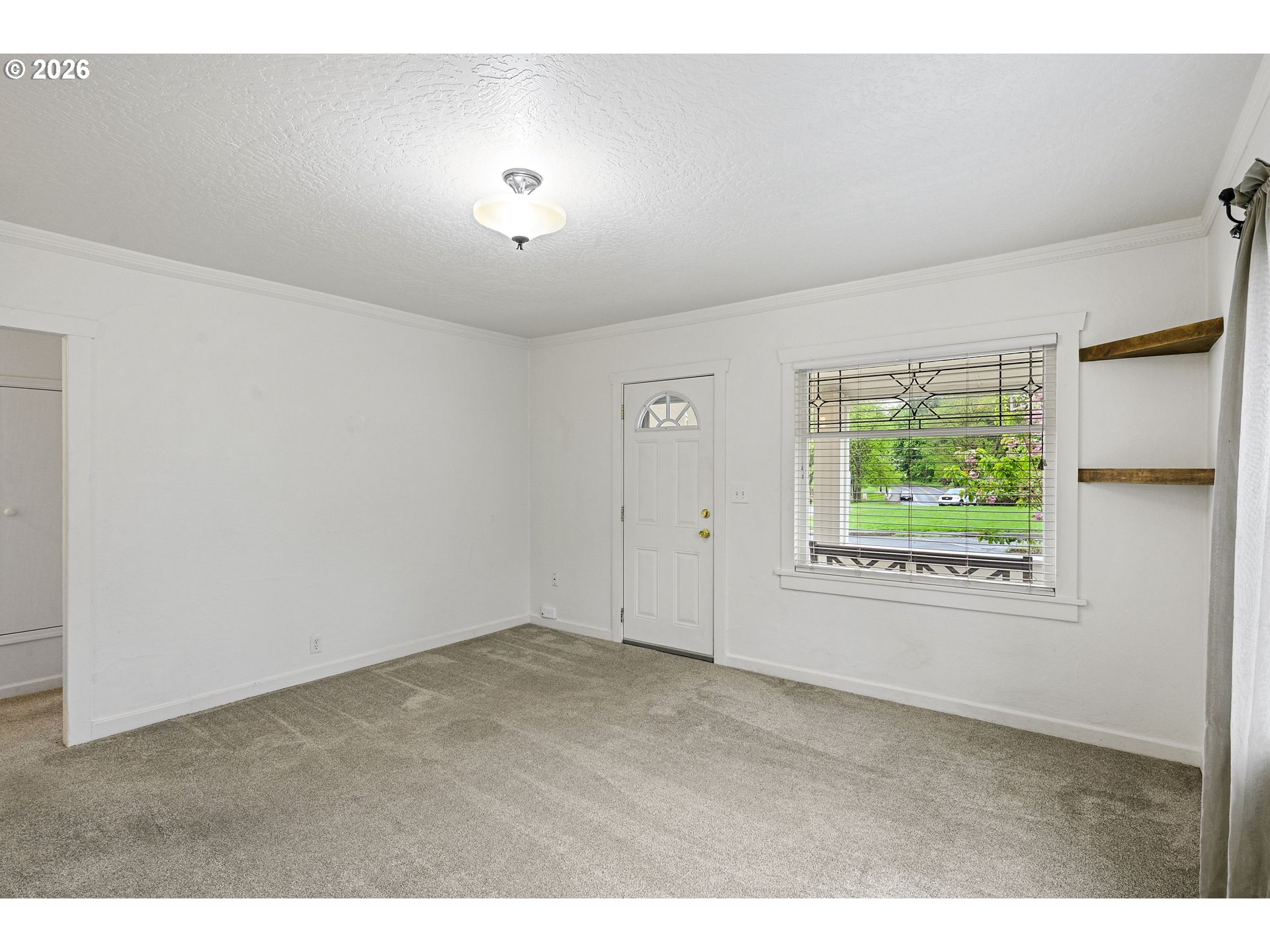 634 Northwest Ivy Street Camas, WA 98607 - Photo 6 of 27 a view of an empty room with a window