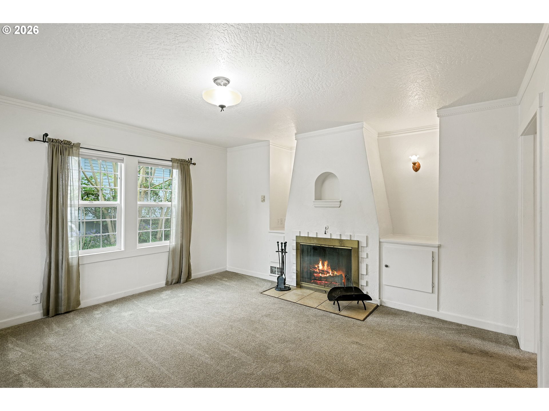 634 Northwest Ivy Street Camas, WA 98607 - Photo 7 of 27 a living room with furniture and a fireplace