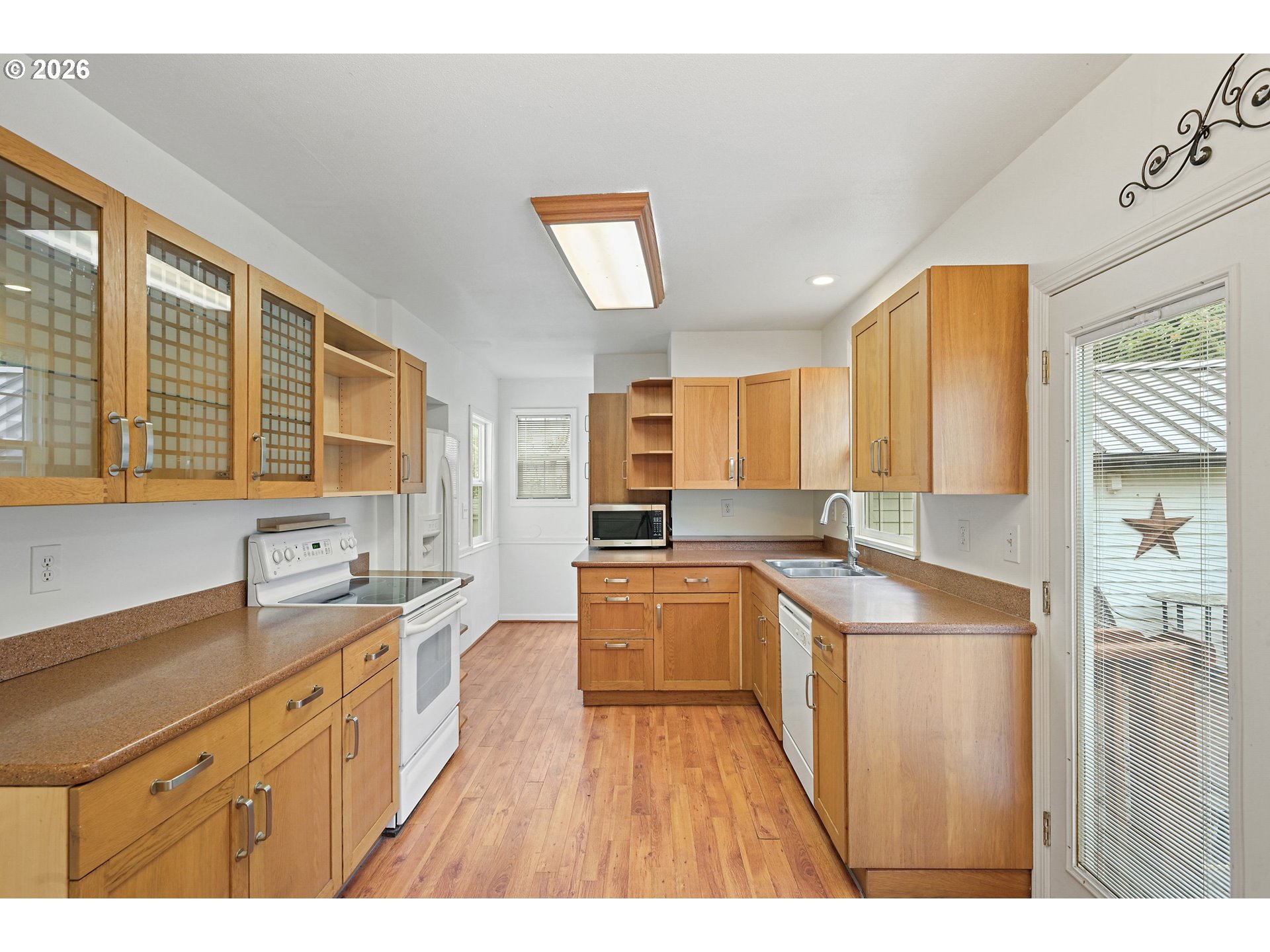 634 Northwest Ivy Street Camas, WA 98607 - Photo 8 of 27 a kitchen with stainless steel appliances granite countertop a sink stove and refrigerator