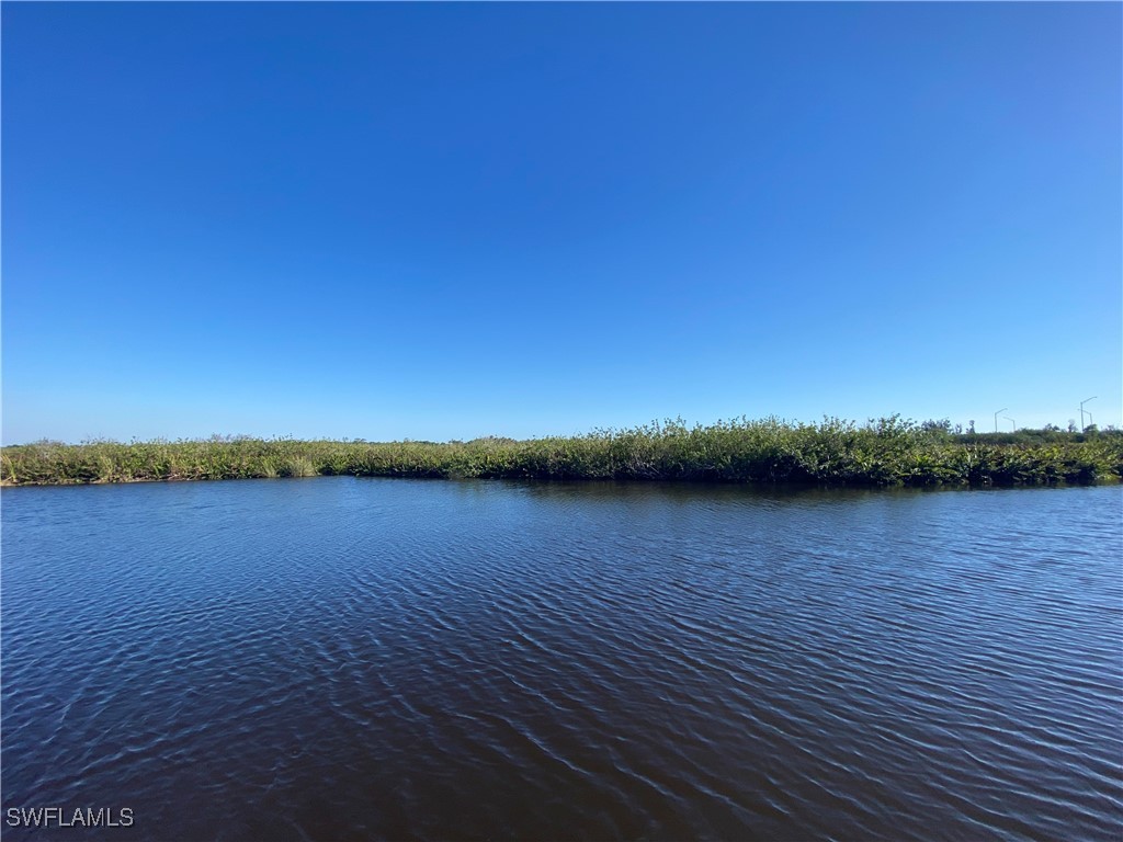3250 Duncan Road Punta Gorda, FL 33982 - Photo 1 of 14 a view of a lake and sunset
