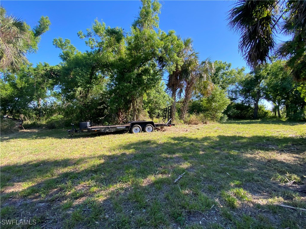 3250 Duncan Road Punta Gorda, FL 33982 - Photo 11 of 14 a view of yard with swimming pool and green space