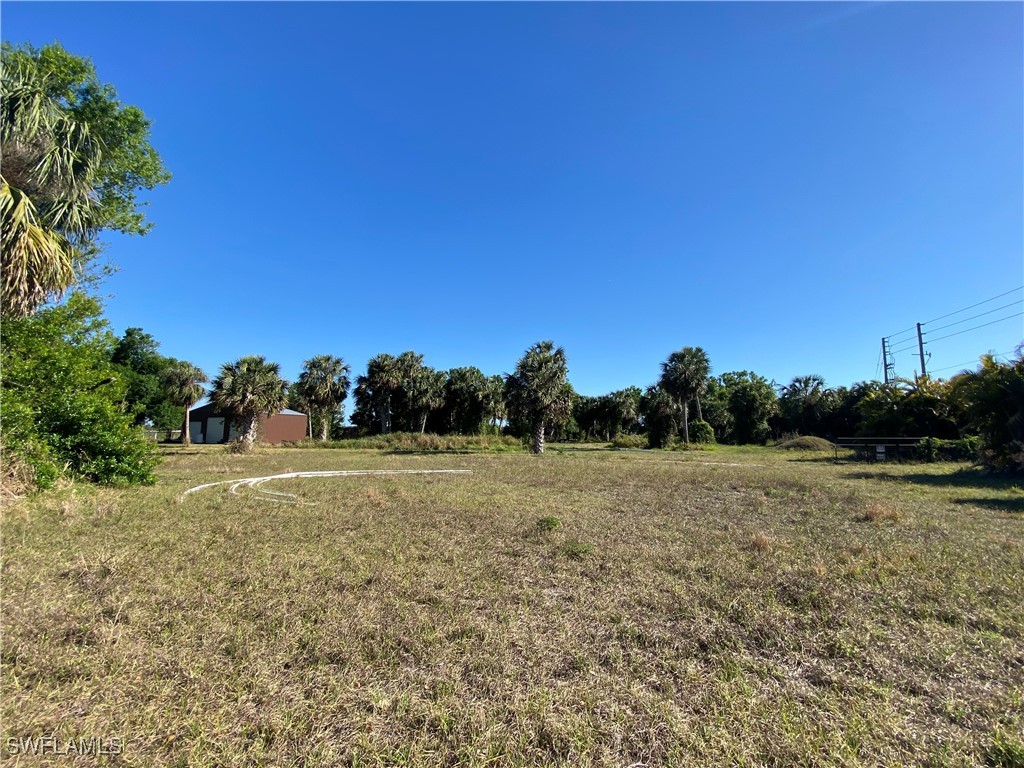 3250 Duncan Road Punta Gorda, FL 33982 - Photo 14 of 14 a view of a field with trees in the background