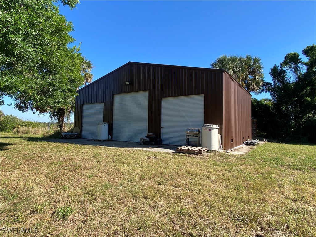 3250 Duncan Road Punta Gorda, FL 33982 - Photo 5 of 14 a house with yard in front of it