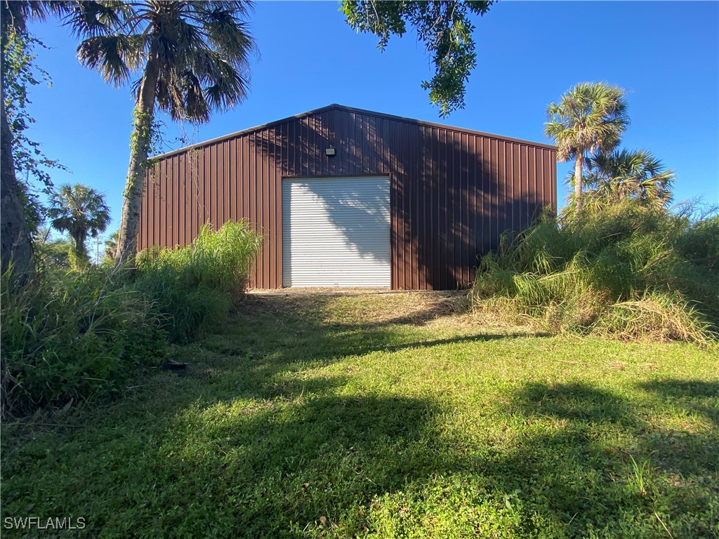 3250 Duncan Road Punta Gorda, FL 33982 - Photo 6 of 14 a view of a house with a yard
