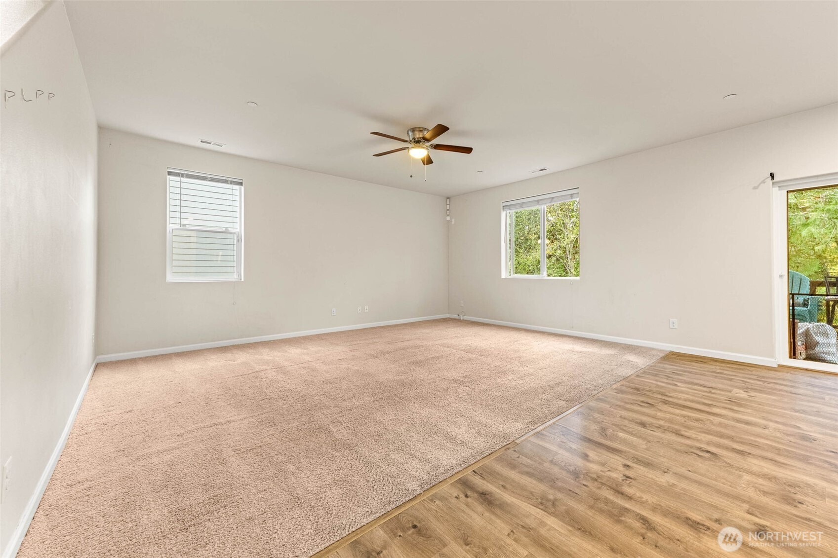 1705 Butler Court Northwest Olympia, WA 98502 - Photo 11 of 40 an empty room with windows and ceiling fan