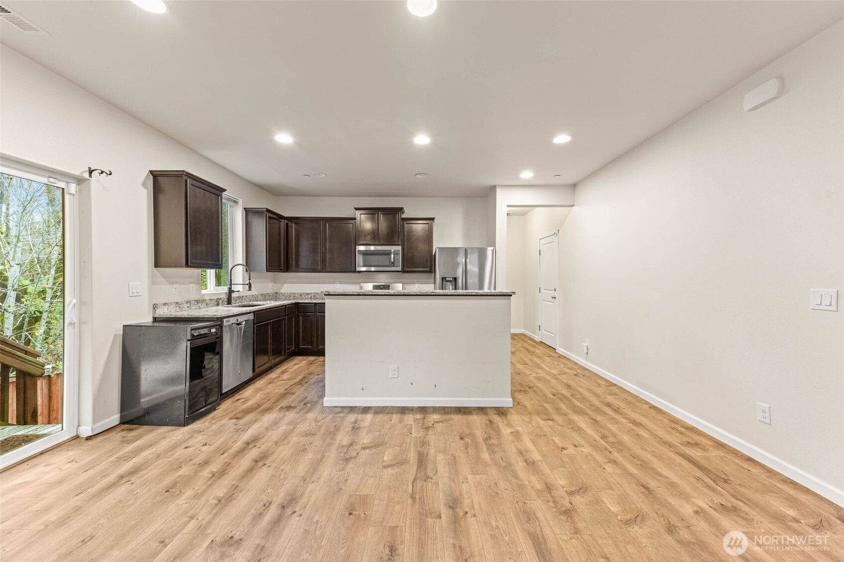 1705 Butler Court Northwest Olympia, WA 98502 - Photo 15 of 40 a large kitchen with a center island and stainless steel appliances