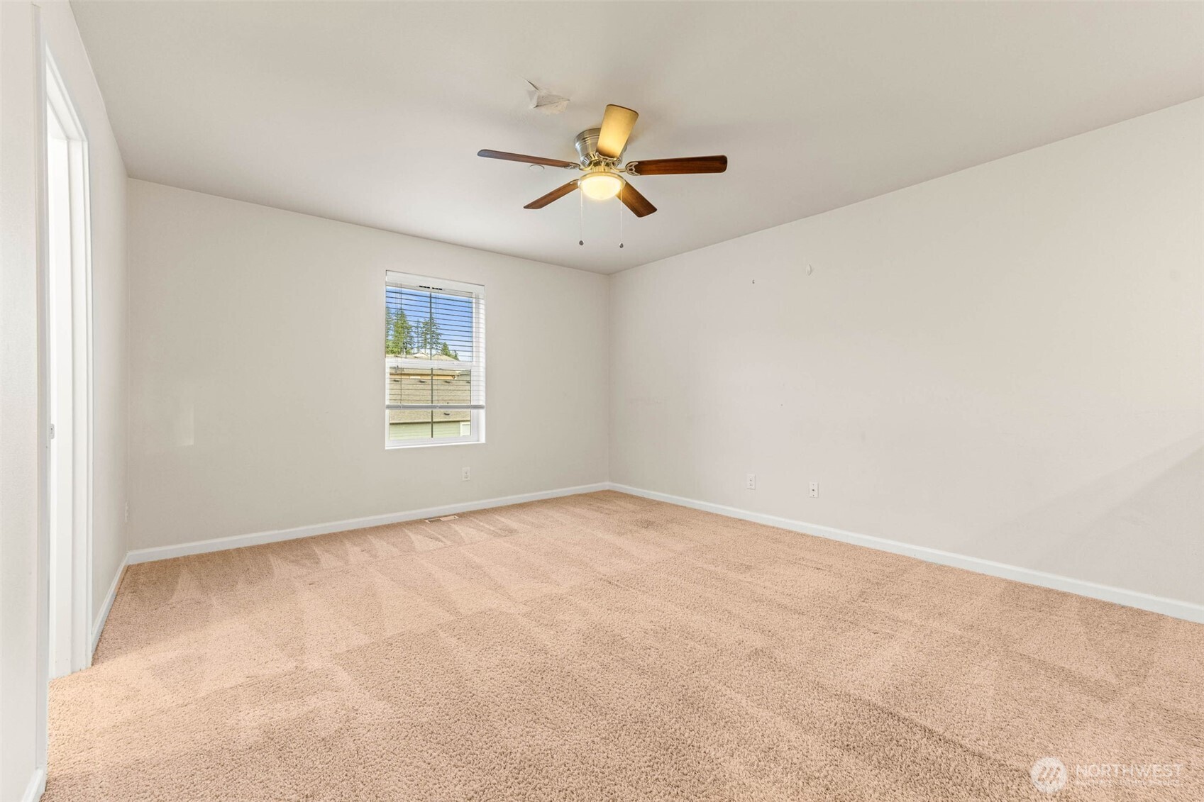 1705 Butler Court Northwest Olympia, WA 98502 - Photo 23 of 40 an empty room with windows and fan