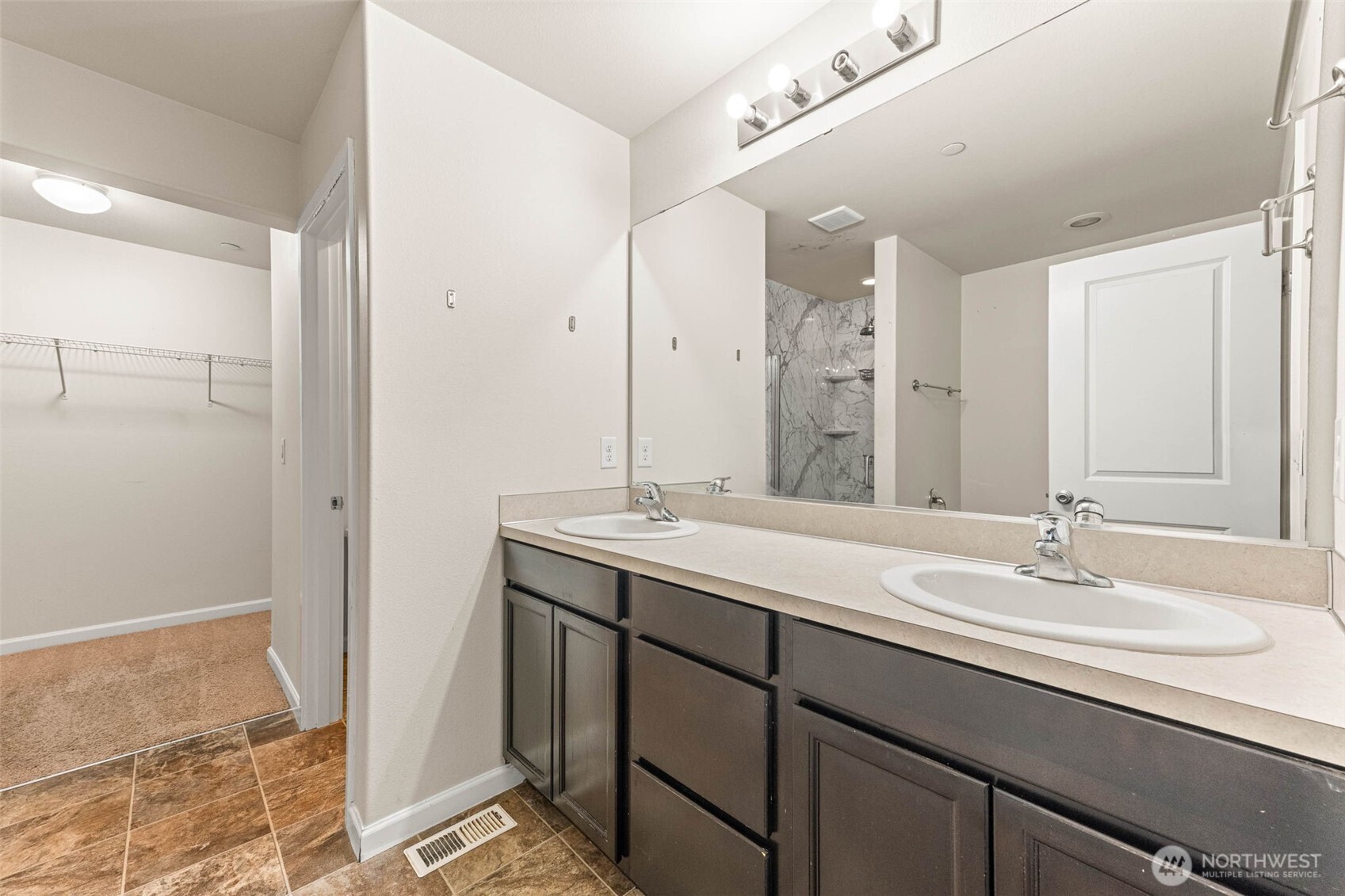 1705 Butler Court Northwest Olympia, WA 98502 - Photo 30 of 40 a bathroom with a sink double vanity and a mirror