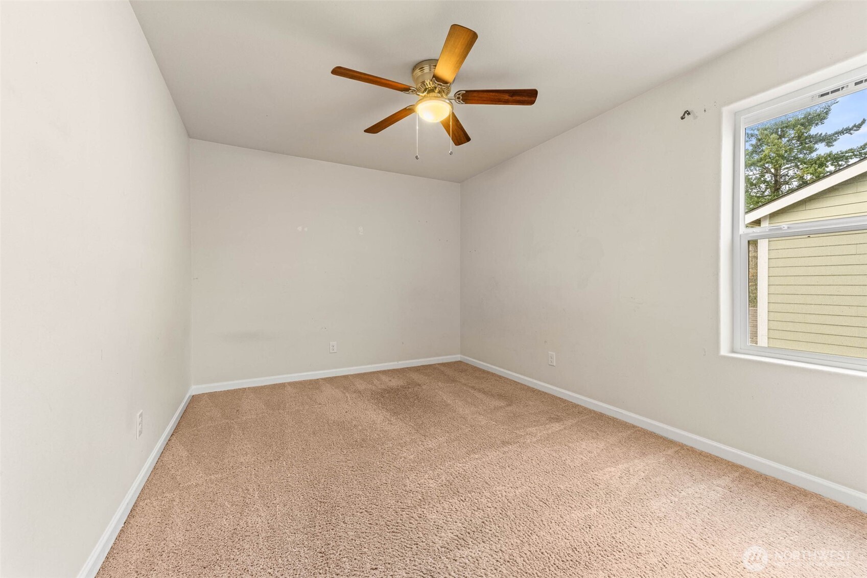 1705 Butler Court Northwest Olympia, WA 98502 - Photo 38 of 40 an empty room with ceiling fan and window