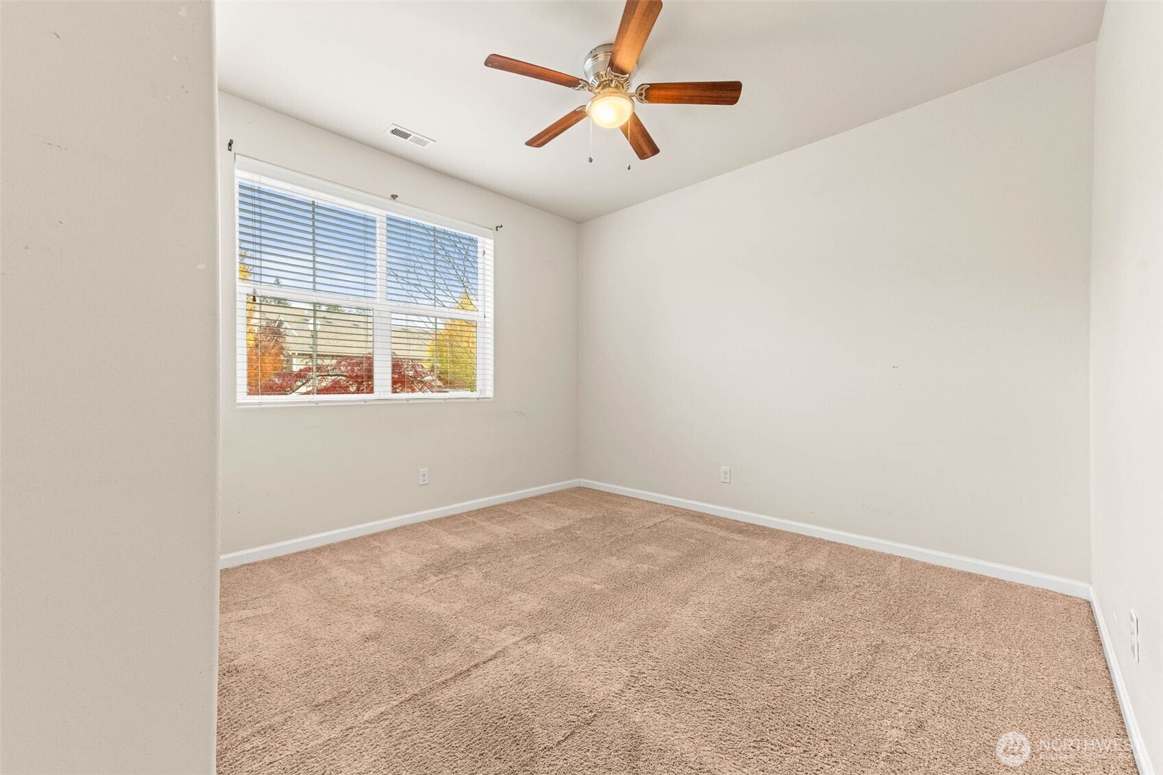 1705 Butler Court Northwest Olympia, WA 98502 - Photo 8 of 40 an empty room with windows and fan