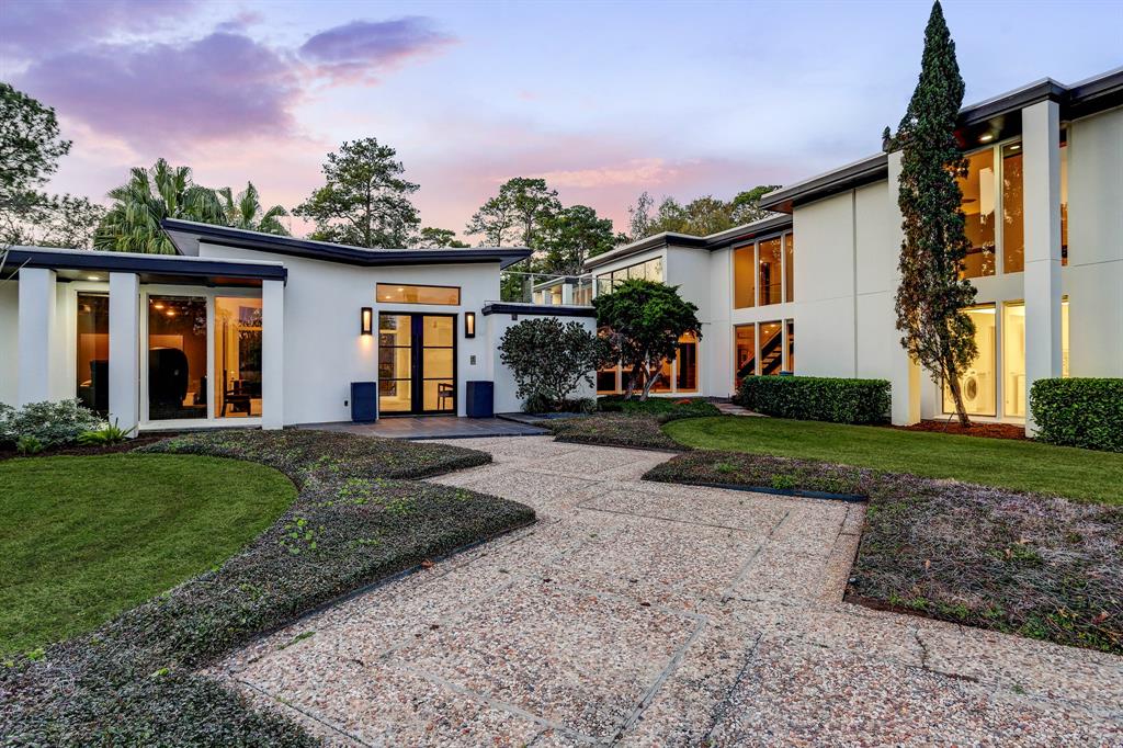 Welcome to 11106 Hedwig Lane - exquisite mid-century modern residence in acclaimed Piney Point.