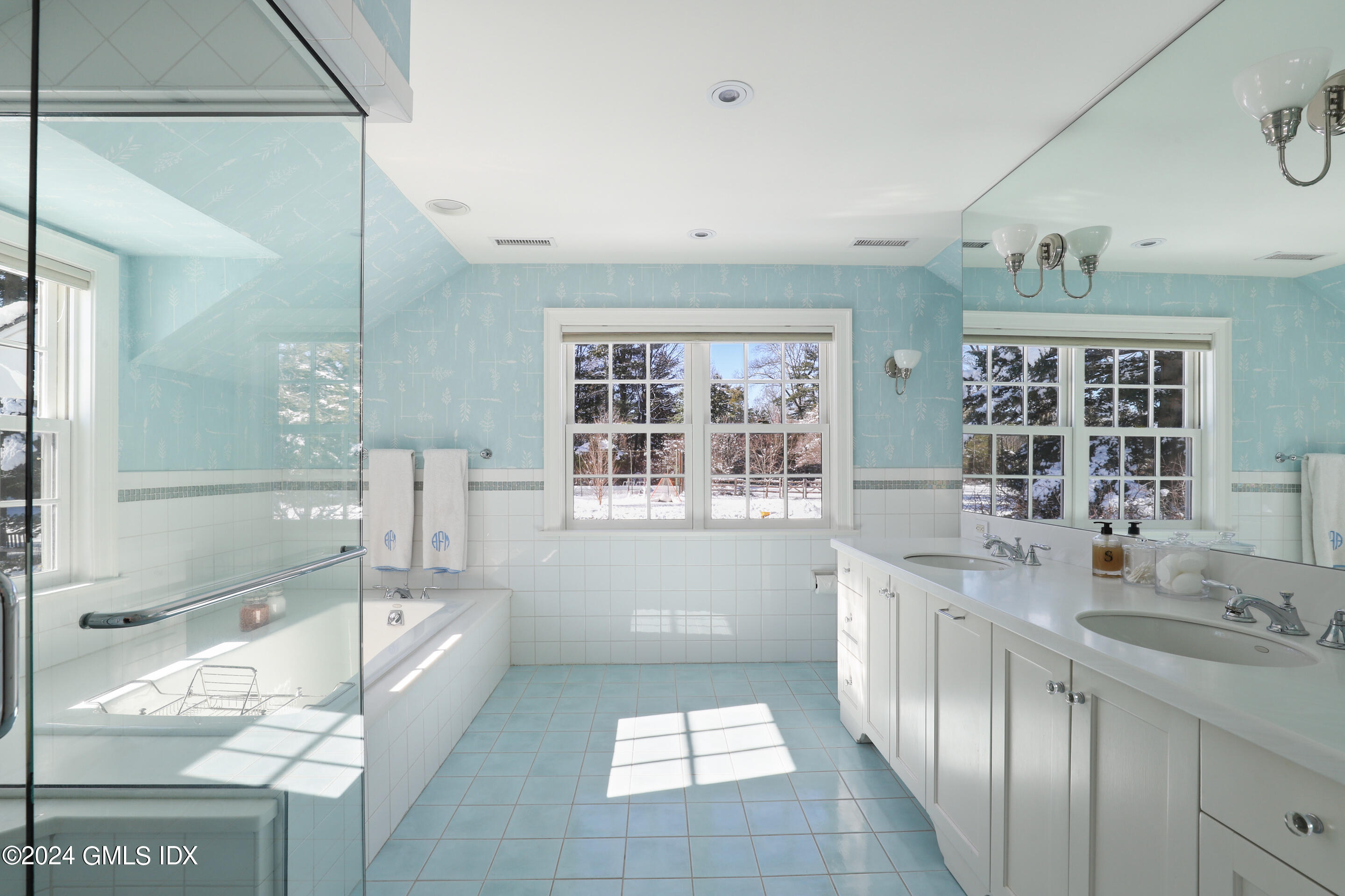 Undisclosed Address Greenwich, CT 06830 - Photo 12 of 19 a bathroom with a tub sink and mirror