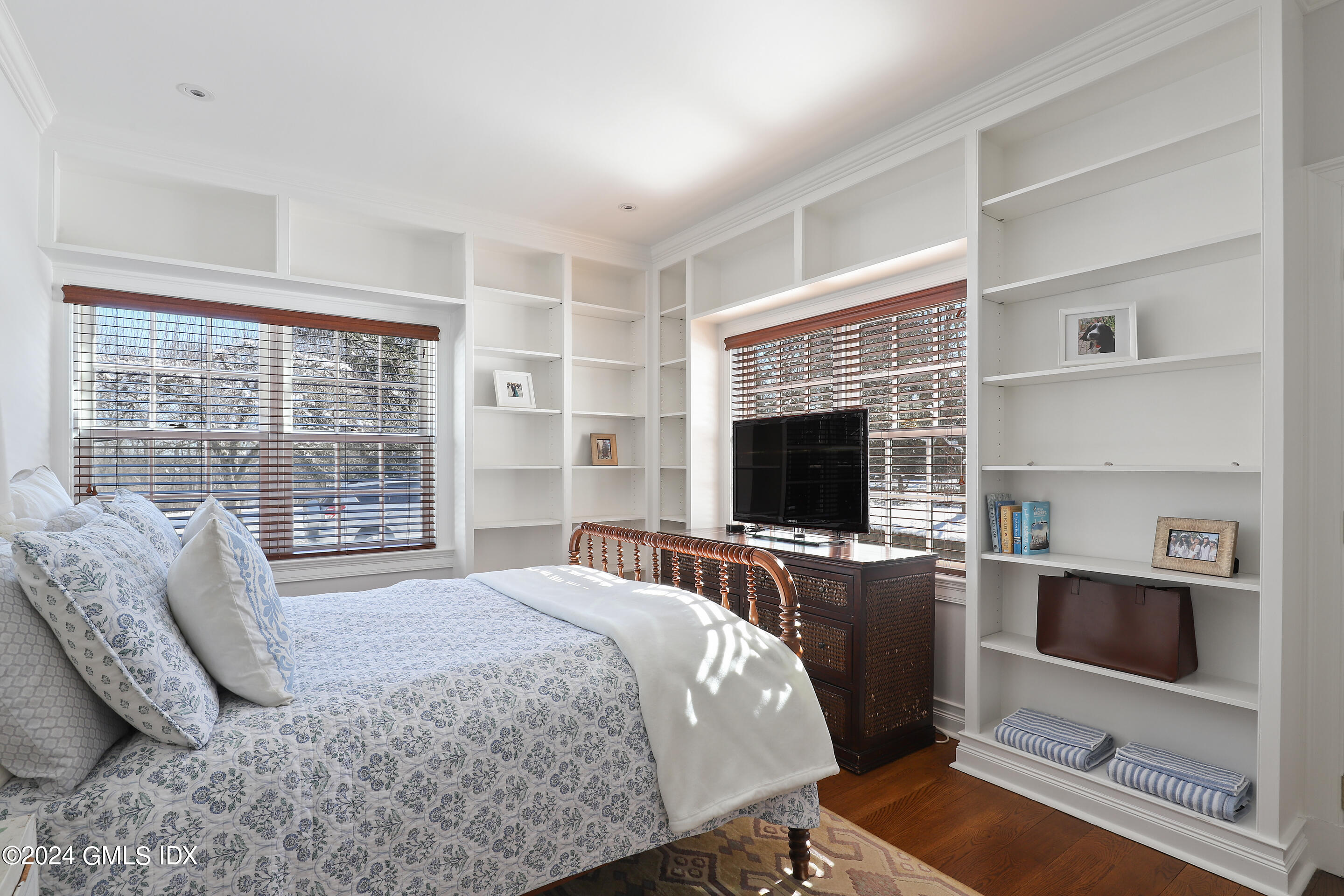 Undisclosed Address Greenwich, CT 06830 - Photo 18 of 19 a bedroom with a bed and a flat screen tv