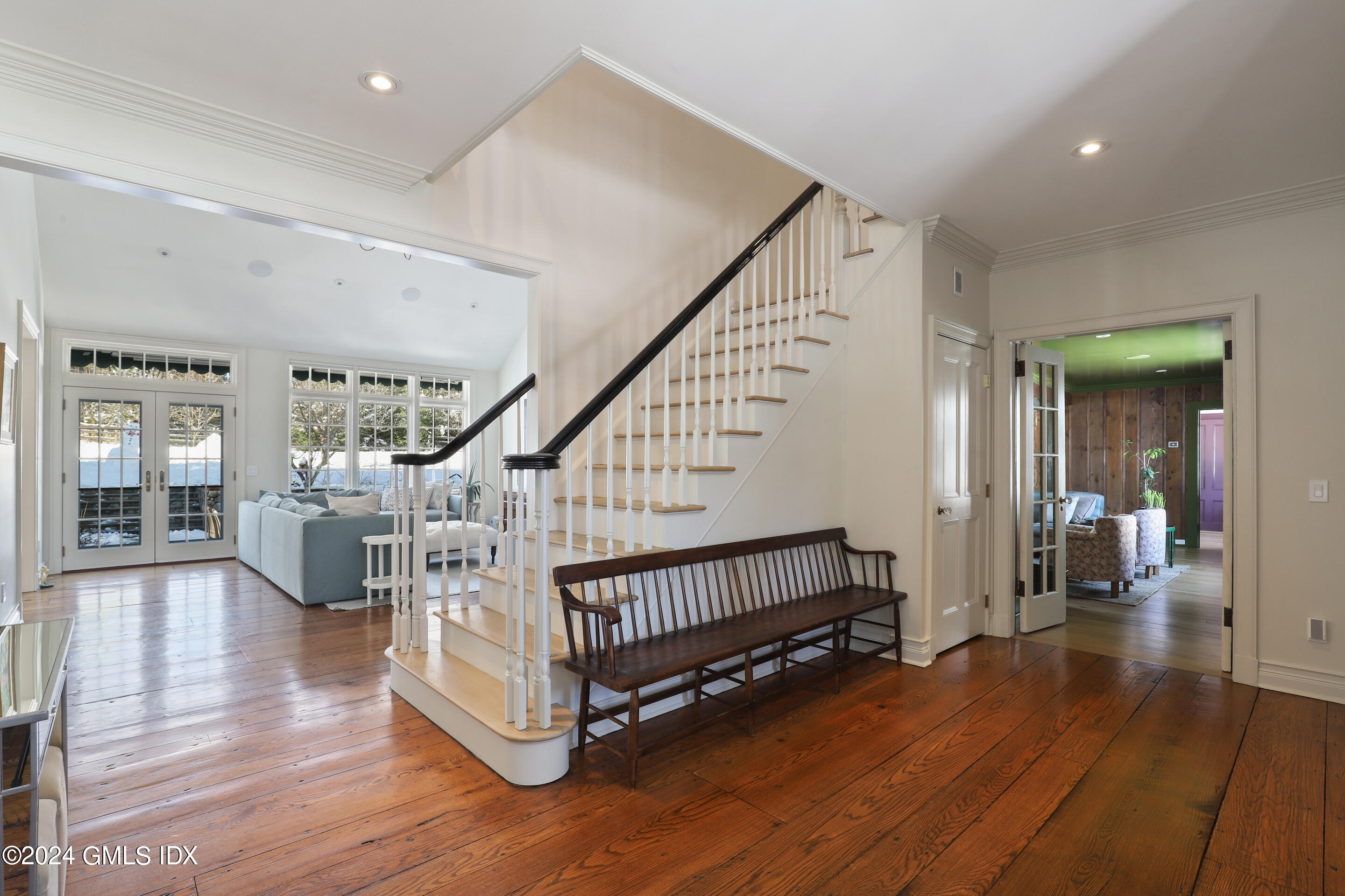 Undisclosed Address Greenwich, CT 06830 - Photo 4 of 19 a view of staircase with furniture and wooden floor